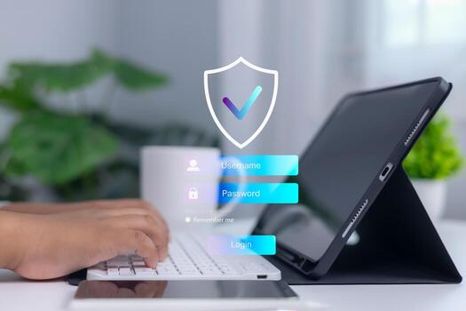 Person logging into secure system on digital tablet with shield and checkmark icon, representing cybersecurity, data protection, and confidential access in modern business technology. photo