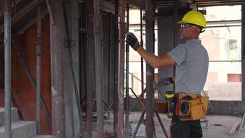 Construction Worker Installing Framework in a Building Under Renovation video