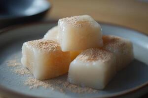 Sweet Mochi Cubes with a Light Dusting of Cinnamon. photo
