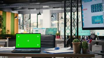 Empty dynamic space in a multinational company with isolated laptop screen, setup for successful business professionals to work with data and explore insights. Strategic development goals. video