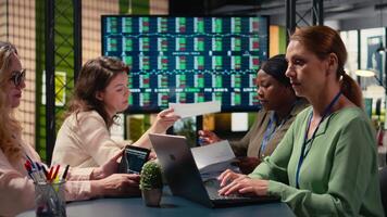 Professional businesswoman working independently in a multinational company, using computer to navigate analytics and write strategic statements that shape corporate direction. Camera A. video