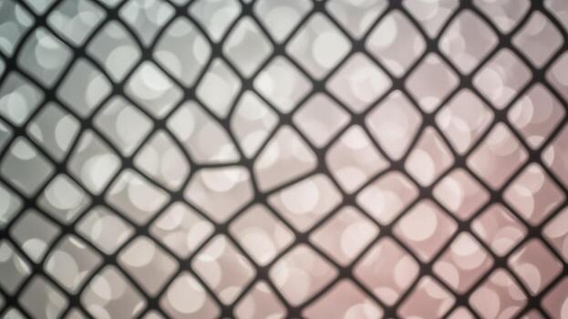 A close up of a net with a blurred background photo