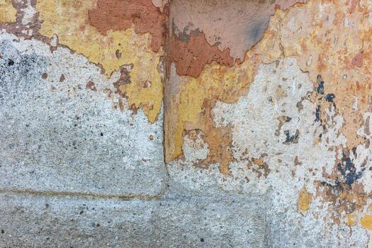 Textured wall with peeling paint, showing an interesting interplay of colors and textures, creating a sense of age. photo