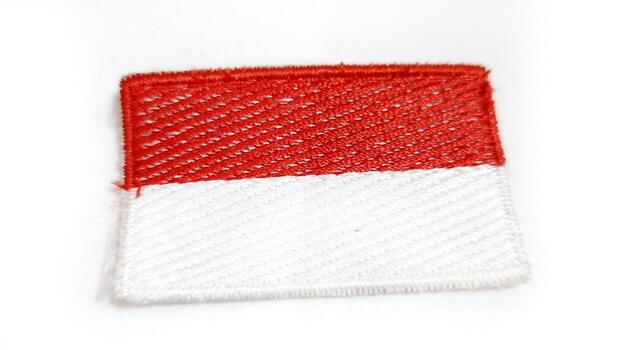Fabric flag of indonesia on a white background close up photo