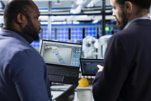 Multiethnic solar panel engineering team shares data insights in factory, working on clean renewable energy manufacturing. Supporting sustainable power with innovation and teamwork. photo