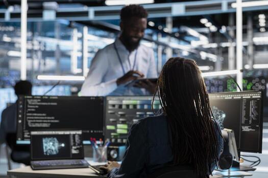 Software developer in data center uses AI technology for machine learning workloads. IT specialist in server hub facility using artificial intelligence to perform demanding computing tasks. photo