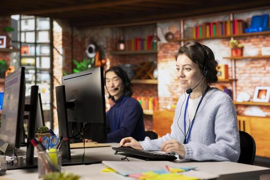 Upbeat call center agent in talking in audio headset, helping customers regain access to accounts and devices. Joyful customer support specialist assisting clients needing help resetting password photo