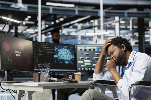 Server hub employee with disability in distress after finding computer bugs. Man with paraplegia panicking after seeing error popping up on screen in data center affecting server configurations photo