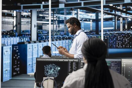 Data center system administrator deploys AI visualization tool to forecast infrastructure demands and optimize resource allocation. Server hub IT expert uses artificial intelligence for maintenance photo