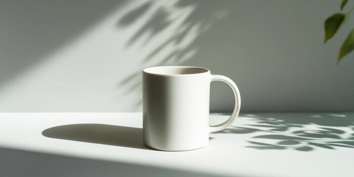 The white ceramic mug is highlighted against a neutral background with soft natural shadows and is ready to apply a logo or text. Panoramic banner photo
