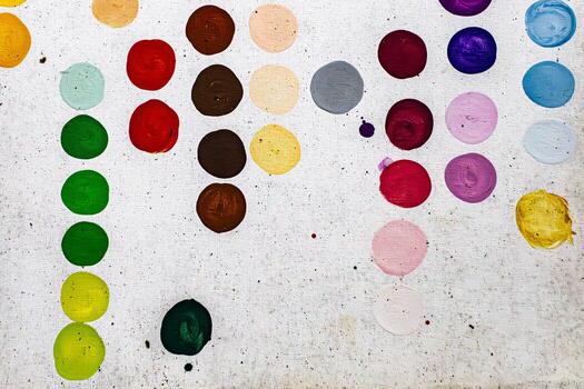 Multicoloured hand painted spots, dots, polka dots or circles on canvas. Grey background. Modern decorative contemporary artwork painting. Random abstract background design pattern and texture. photo