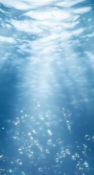Underwater scene with light filtering through clear azure water bubbles ascending creating serene mesmerizing view photo