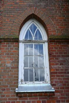 a window with a cross in it photo