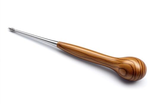 Wooden-handled tool with metal prong resting on a white background, ideal for crafts photo