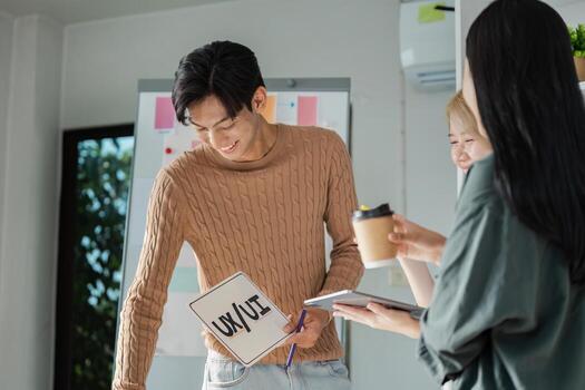 Creative UX UI Design Team Brainstorming Session with Digital Devices and Collaborative Ideas photo