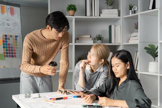 Collaborative UX UI design session with team discussing concepts and enjoying coffee. photo