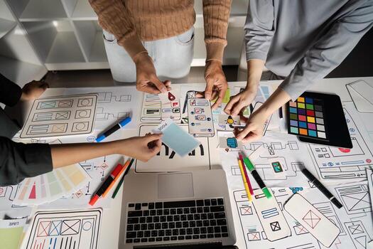 Creative UX UI Design Brainstorming Session with Diverse Team Collaborating on Innovative Digital Interface Concepts photo