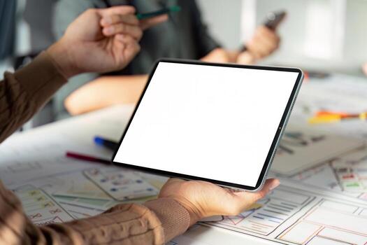Modern UX UI Design Process with Digital Tablet and Creative Team Collaboration in Office Environment photo