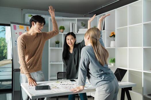 Creative UX UI Design Team Brainstorming Session in Modern Office Environment with Diverse Designers Collaborating on Innovative Ideas photo