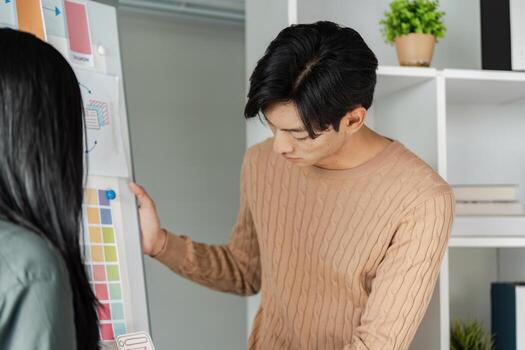 Young Professionals Collaborating on UX UI Design in Modern Office Environment for Business Innovation and Development photo