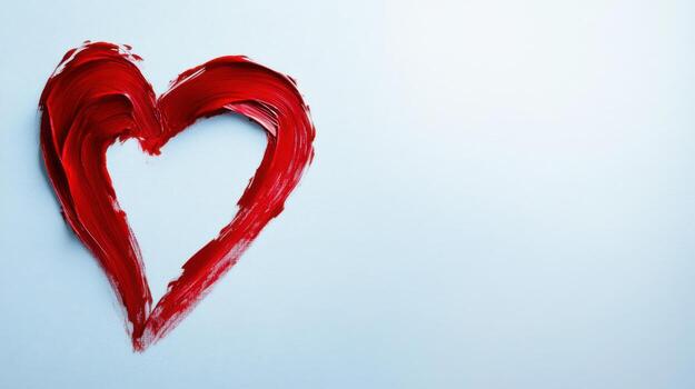 A vibrant red heart shape is artfully painted in bold strokes against a soft light background, symbolizing emotions like love and passion. The simplicity and color convey warmth and connection photo