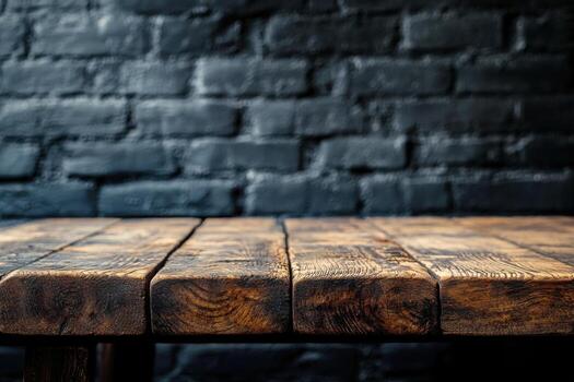 A table with a wooden top and brick wall photo