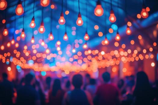 People are standing in front of a crowd of people with lights photo