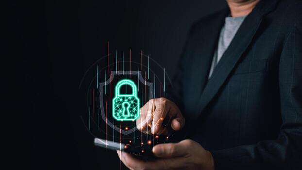 A person interacts with a smartphone, projecting a glowing digital lock symbolizing cyber protection. The futuristic interface highlights secure data, encryption, and online security measures. photo