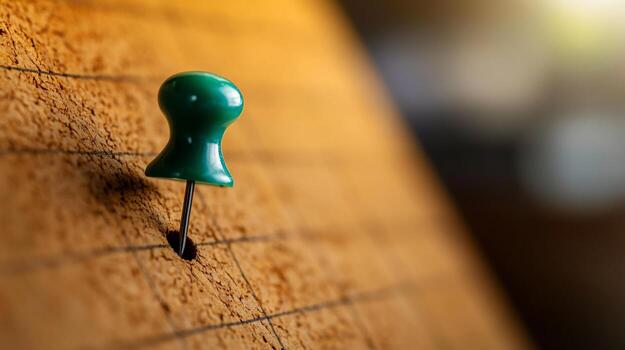 A Close-Up View of a Single Green Push Pin Puncturing a Corkboard Surface, a Symbol of Location or Reminder photo