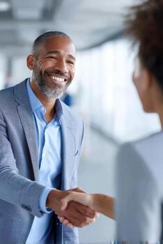 Latino professional shows doubt while shaking hands in an office setting during a networking moment photo