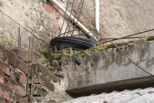 a close up of wires and cables on a wall photo