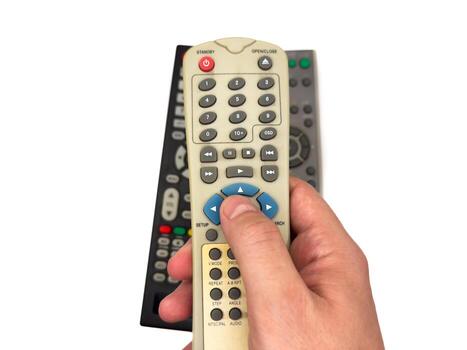 White man hand on white background presses buttons on silver TV remote control, 3 TV remote control photo