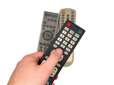 Man on white background presses buttons on old black TV remote control, 3 TV remote control photo
