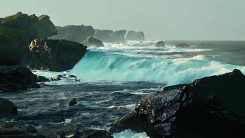 Rugged Coastline Crashing Tides and Misty Jagged Rocks video