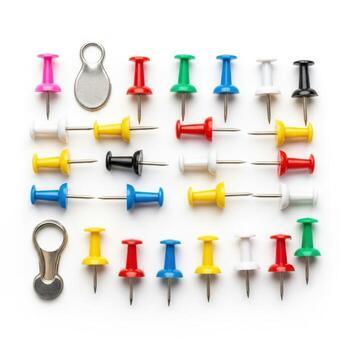 Colorful pushpins and fasteners arranged in a grid on white background photo