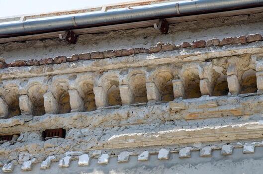 The building has a lot of cracks and is in need of repair. The roof is also damaged and needs to be replaced photo