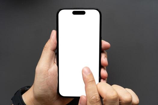 Hand Touching Smartphone with Blank White Screen on Dark Background. finger touching the display, isolated against a dark background. Ideal for app mockups, UI presentations, and technology concepts. photo