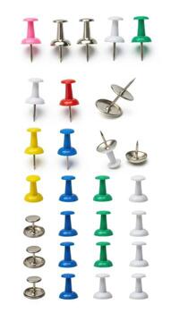 Various colorful push pins isolated on white background photo