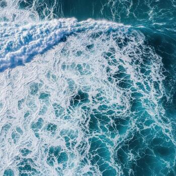 aéreo ver de poderoso Oceano olas estrellarse con blanco espuma foto