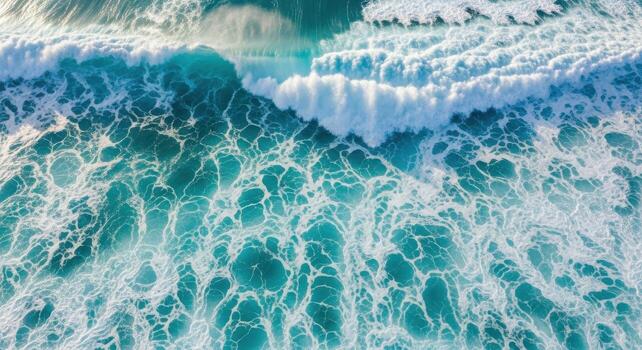 Turquoise ocean waves with white foam seen from above photo