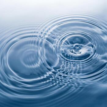 Concentric water ripples from a single drop photo