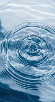 Vertical view of water ripples from a falling drop photo