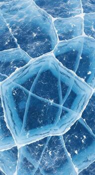 Intricate geometric patterns formed by fractures in deep blue ice photo