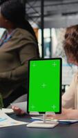 Vertical Team of goals oriented women work with a copy space display on tablet in a modern boardroom,hosting a business discussion with general reports insight. Company strategy for growth. Camera A. video