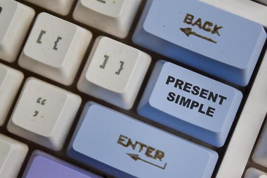 Present Simple one of the verb in modern english on the button keyboard photo