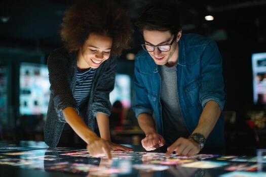Two people looking at a digital screen photo