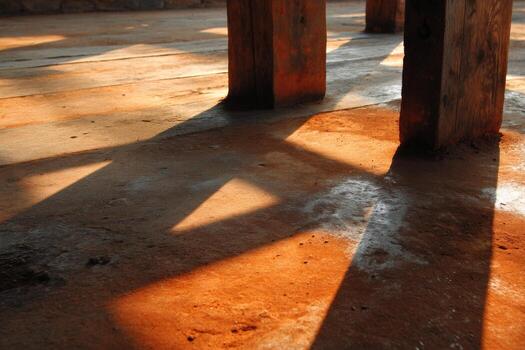 A person sitting on a bench with a skateboard photo