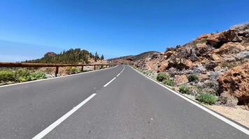 A stunning winding road meanders through picturesque mountains, perfect for travel inspiration and adventure video