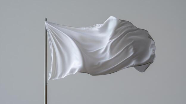 A white flag flutters softly in the wind, showcasing its smooth texture. The backdrop is neutral, emphasizing the flag's flowing motion and simplicity under daylight photo