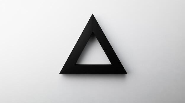 A black triangle on a white background photo